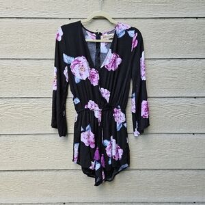 Reverse black floral long sleeve romper large